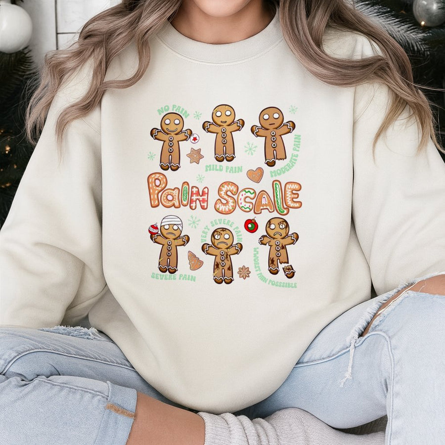 Funny Gingerbread Pain Scale Sweatshirt | Cute Christmas Nurse Graphic Tee | Premium Cotton Blend Crewneck | Holiday Gift for Nurses & Medical Staff