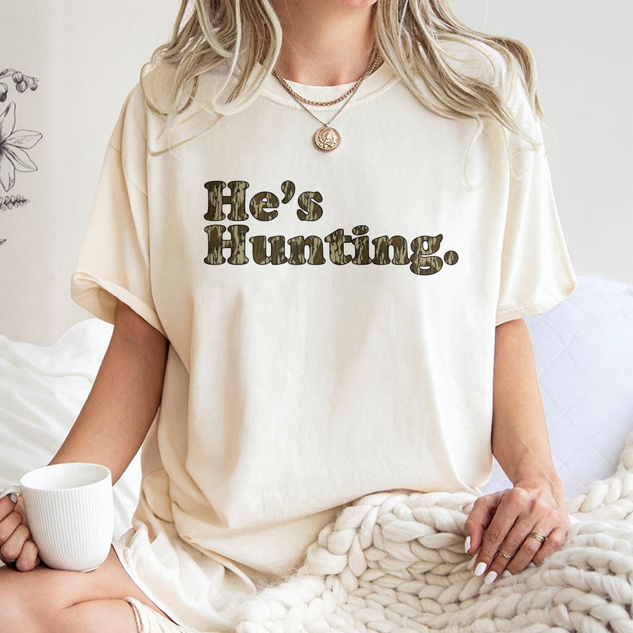 He's Hunting T-Shirt | Camo Print Graphic Design | 100% Cotton Premium Tee | Outdoor Enthusiast Gift for Men and Women