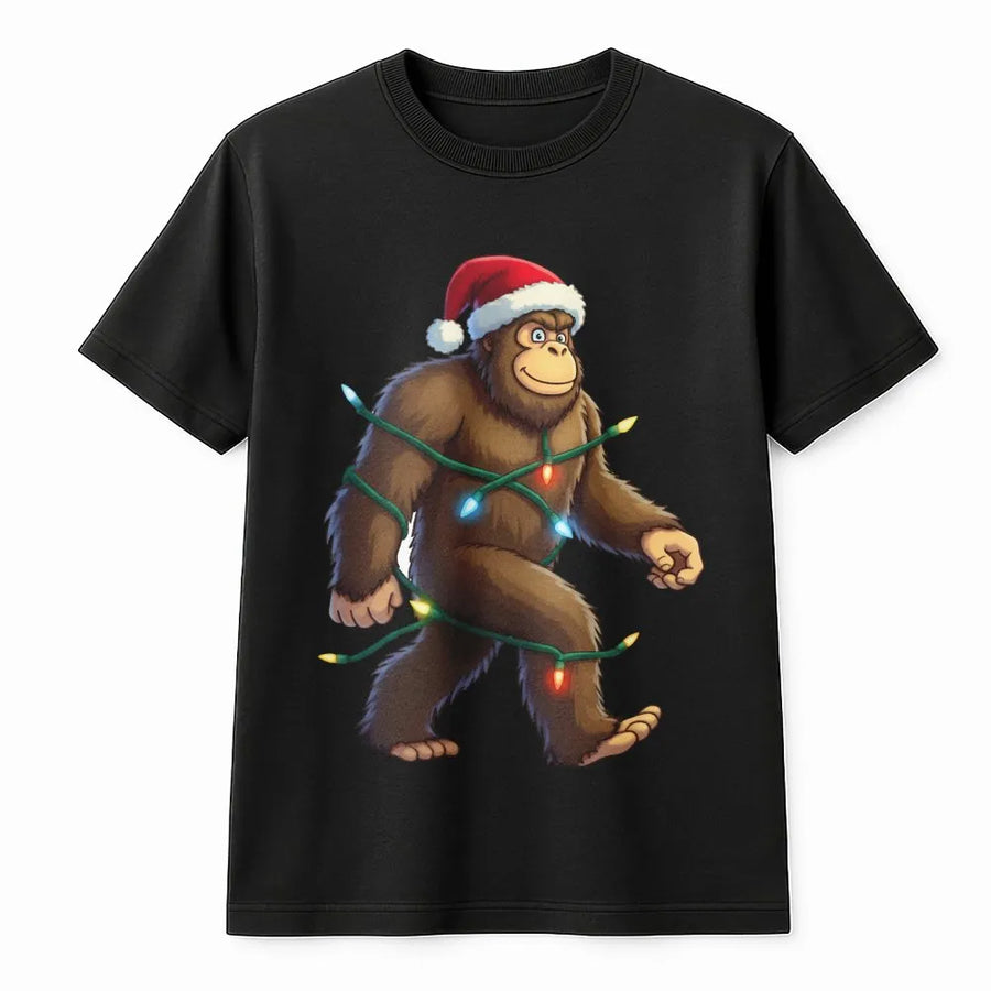 Bigfoot Christmas T-Shirt | Funny Sasquatch Wearing Santa Hat & Holiday Lights | Premium Soft Cotton Graphic Tee | Unique Xmas Gift For Him