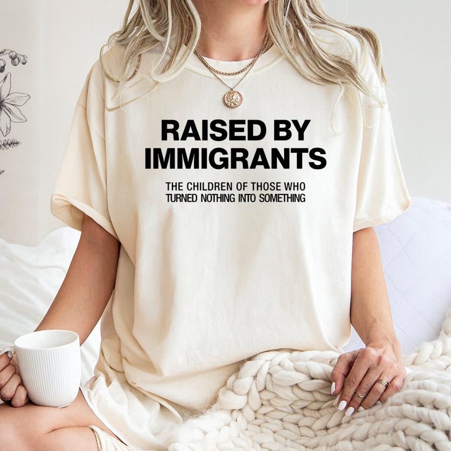 Raised By Immigrants T-Shirt | First Generation Pride Gift | 100% Cotton Premium Tee | Empowering Cultural Heritage Shirt For Men And Women