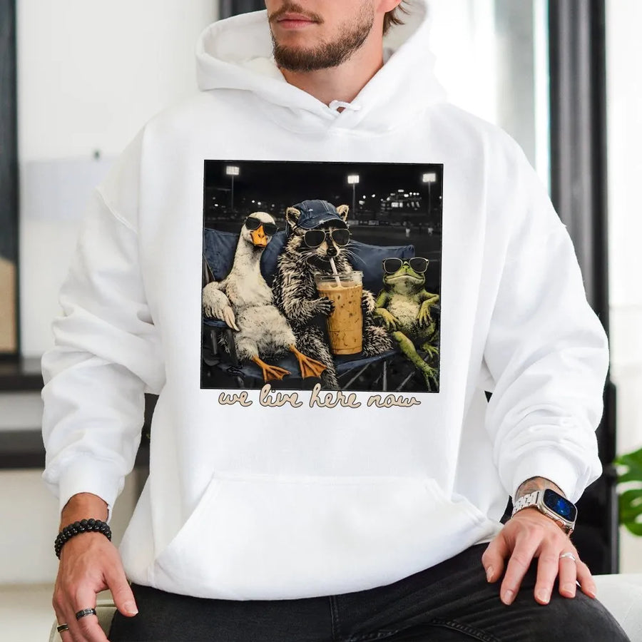 We Live Here Now Hoodie | Funny Goose Raccoon Frog Graphic | Soft Unisex Crewneck | Gift for Baseball Mom, Ballfield Life Apparel