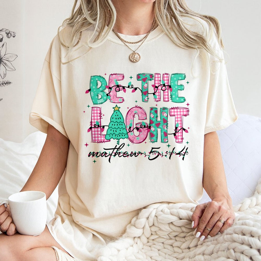 Be The Light Christmas T-Shirt | Bible Verse Matthew 5:14 Graphic | 100% Premium Cotton Tee | Faith-Based Holiday Gift for Women and Men