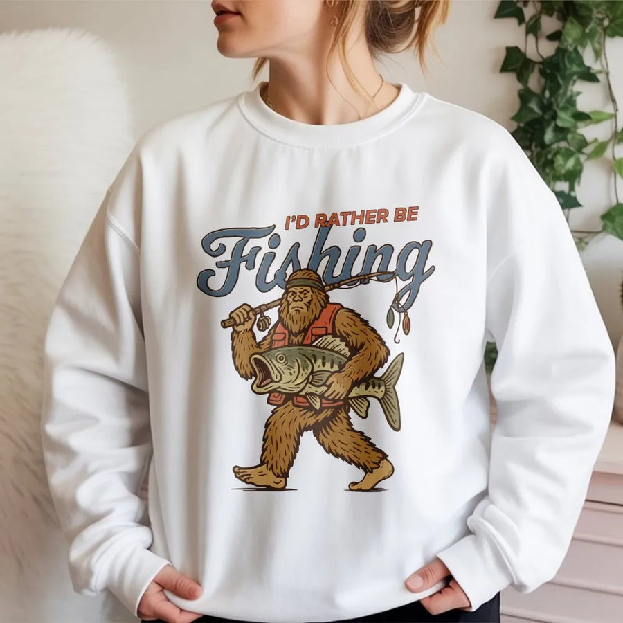 Sasquatch Fishing Sweatshirt | Retro I'd Rather Be Fishing Graphic | Premium Cotton Blend | Funny Gift for Fisherman and Cryptid Lovers