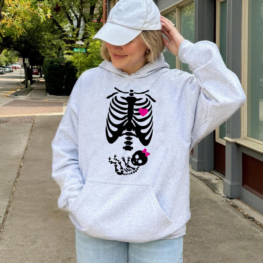Pregnant Skeleton Hoodie | Cute Baby Girl Announcement Graphic | Premium Cotton Blend | Funny Expectant Mom Halloween Gift