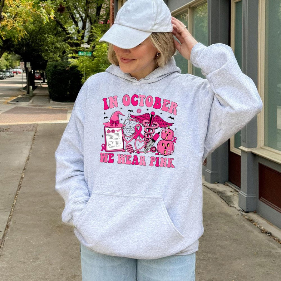In October We Wear Pink Nurse Hoodie | Breast Cancer Awareness Halloween Graphic | Cotton-Blend Comfort | Gift for Nurses and Cancer Survivors