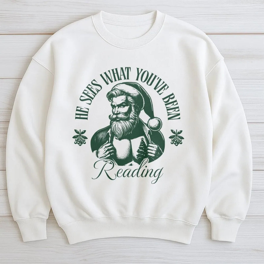 He Sees What You've Been Reading Sweatshirt | Funny Santa Book Lover Graphic | Cozy Cotton Blend Apparel | Christmas Gift For Readers And Librarians