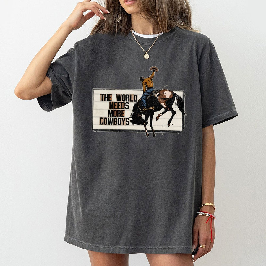 The World Needs More Cowboys T-Shirt | Retro Western Rodeo Graphic Tee | 100% Premium Cotton | Country Music & Ranch Life Gift for Adults