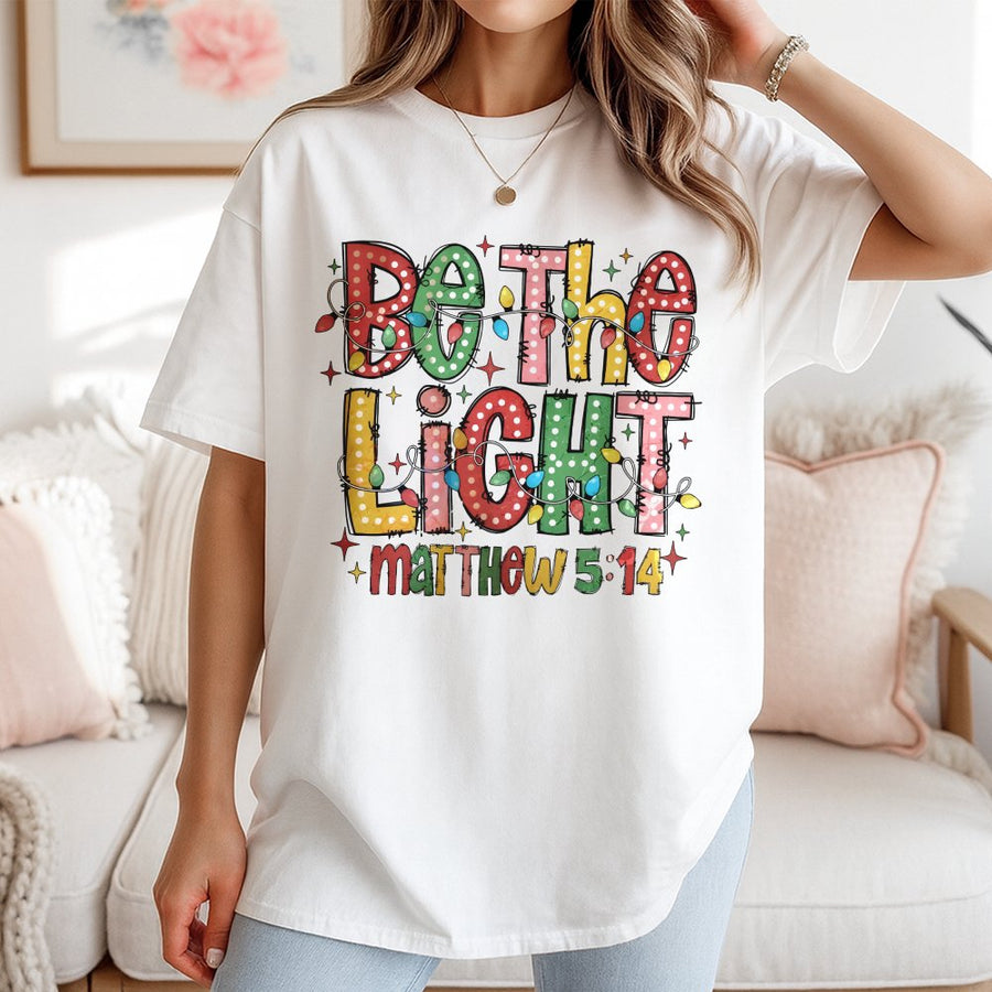 Be The Light T-Shirt | Matthew 5:14 Christmas Bible Verse Graphic | 100% Cotton Premium Tee | Christian Religious Gift for Women and Men