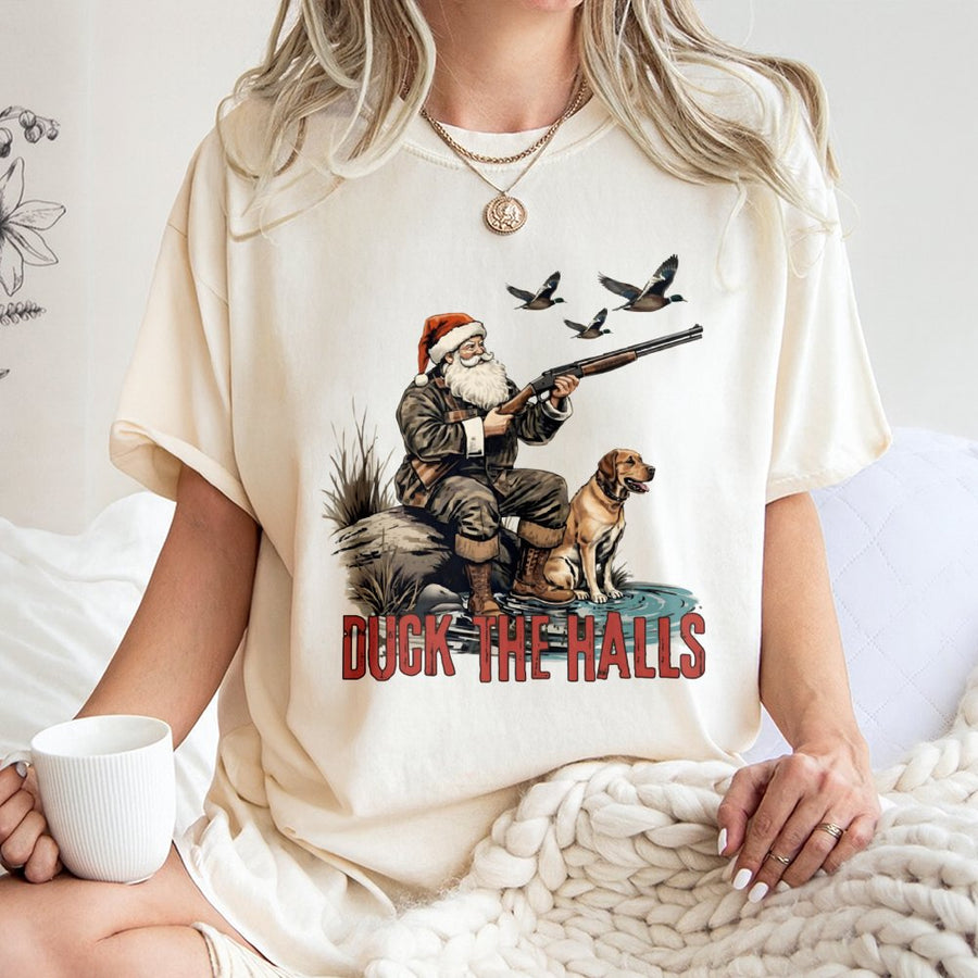 Duck The Halls Hunting T-Shirt | Santa Claus Duck Hunter Graphic | 100% Cotton Premium Tee | Funny Christmas Gift for Hunters and Outdoorsmen
