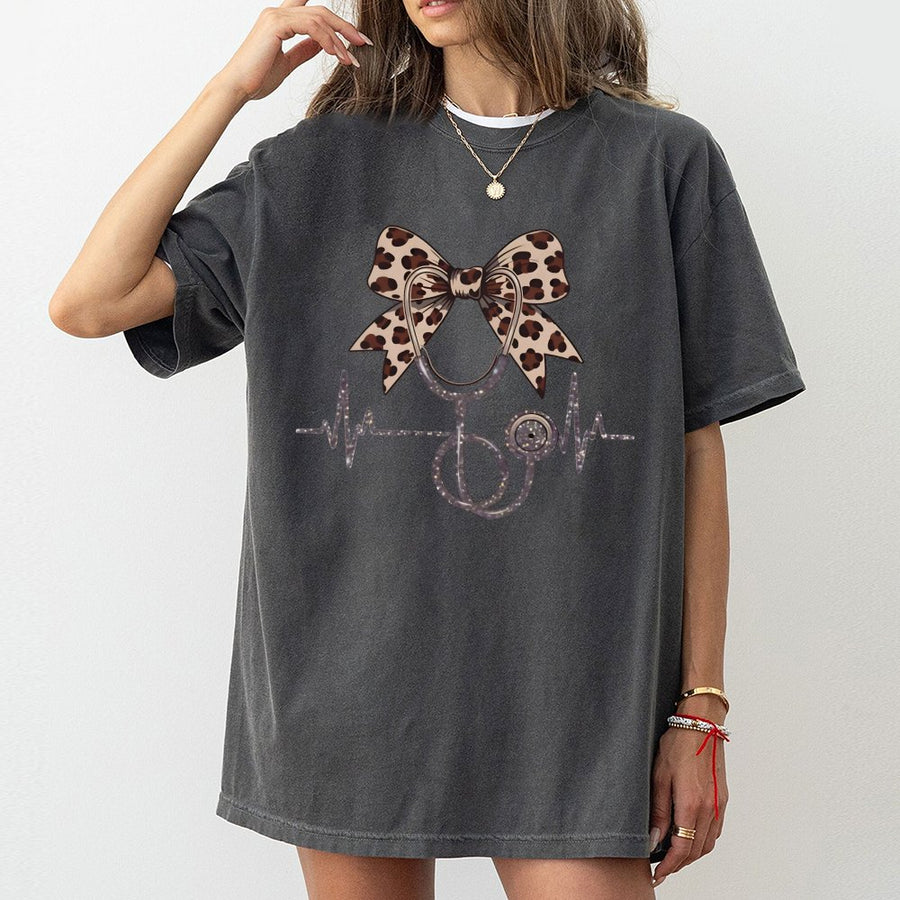 Nurse T-Shirt With Leopard Coquette Bow | Cute Stethoscope Heartbeat Graphic | 100% Cotton Premium Tee | Graduation Gift For Registered Nurse
