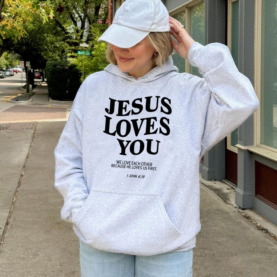 Jesus Loves You Hoodie | 1 John 4:19 Bible Verse Graphic | Premium Cotton Blend | Christian Gift for Men and Women