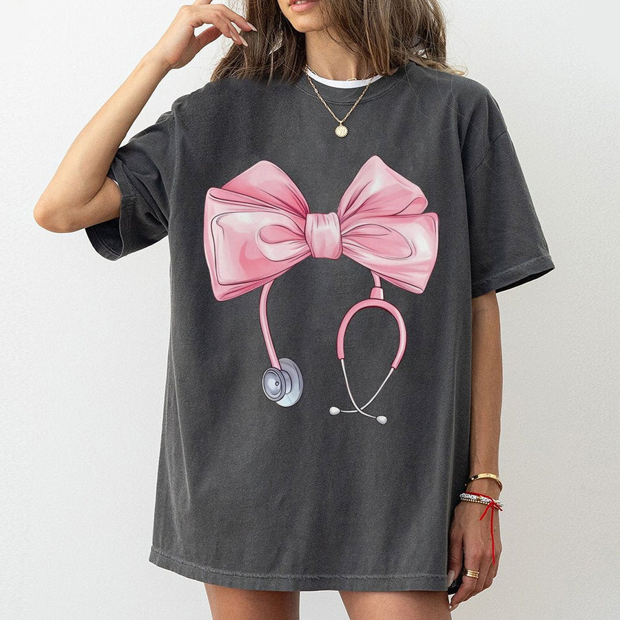 Coquette Nurse T-Shirt | Pink Bow Stethoscope Graphic Tee | 100% Cotton Premium Quality | Cute Nursing Student Gift & Appreciation Apparel