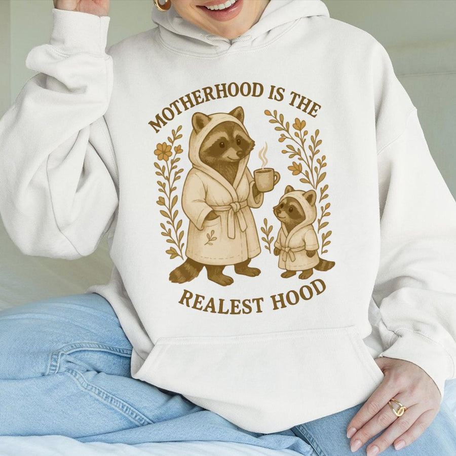 Motherhood Is The Realest Hood Hoodie | Cute Raccoon Mom Design | Premium Cotton Blend | Funny Mother's Day 2026 Gift For New Mom