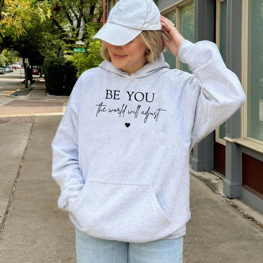 Be You The World Will Adjust Hoodie | Inspirational Quote Graphic Sweatshirt | Premium Cotton Blend Apparel | Motivational Gift for Her or Him
