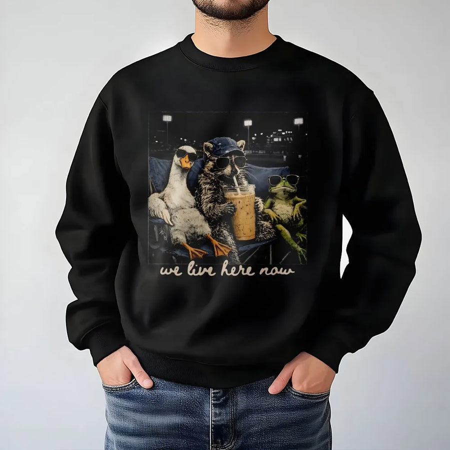 We Live Here Now Sweatshirt | Funny Goose Raccoon Frog Graphic | Soft Unisex Crewneck | Gift for Baseball Mom, Ballfield Life Apparel