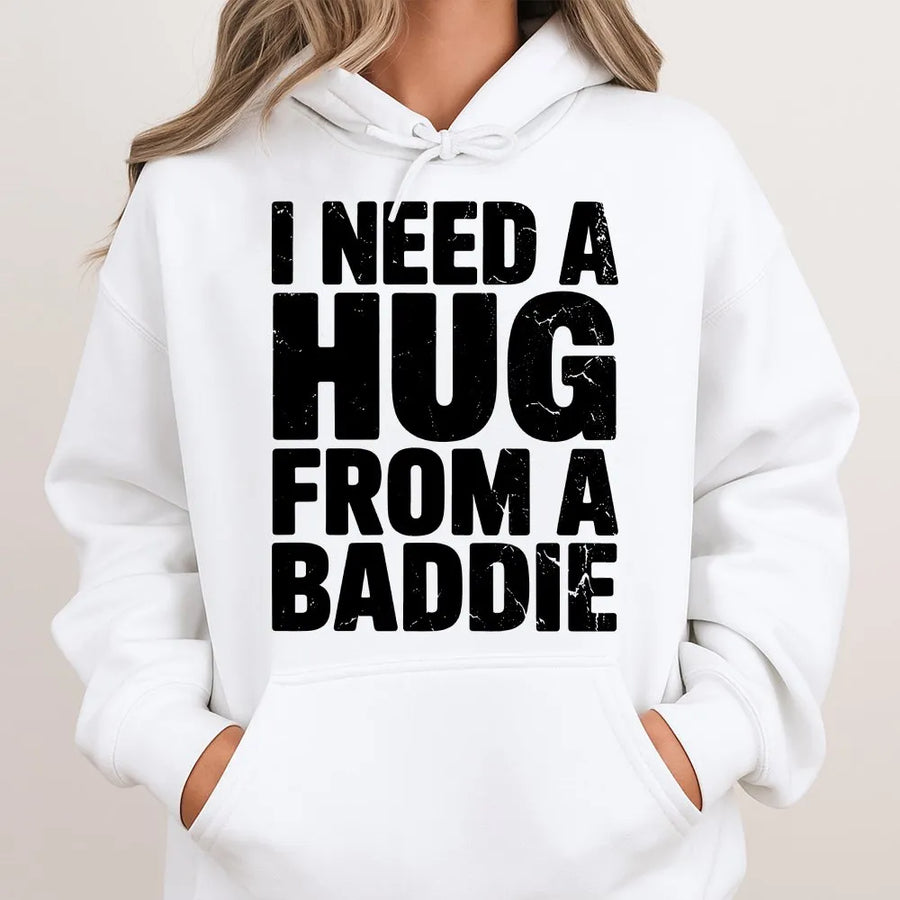 I Need A Hug From A Baddie Hoodie | Funny Sarcastic Quote Graphic | Premium Cotton Blend Unisex Sweatshirt | Trendy Gen Z Gift for Her