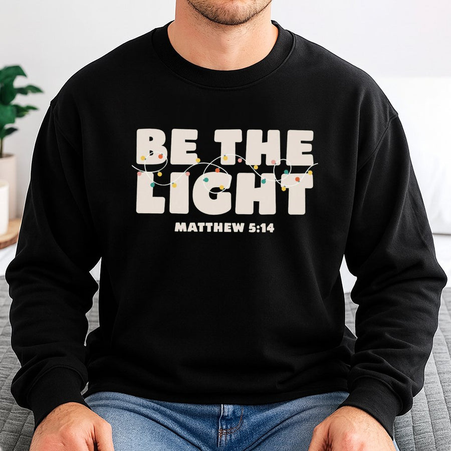 Be The Light Sweatshirt | Matthew 5:14 Christmas Bible Verse Graphic | Premium Cotton Blend | Faith-Based Religious Christian Gift for Women