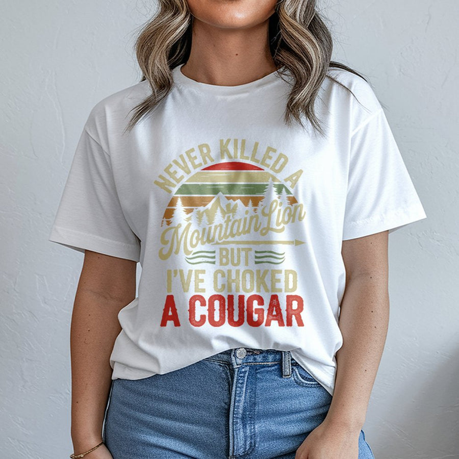 Never Killed A Mountain Lion But I've Choked A Cougar T-Shirt | Retro Outdoors Humor Graphic | Premium Cotton Unisex Tee | Funny Gag Gift For Him