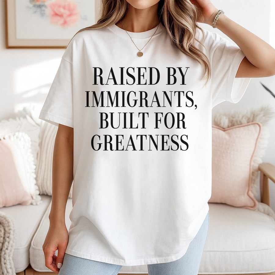Raised By Immigrants T-Shirt | Built For Greatness Quote Graphic Tee | 100% Cotton Premium Unisex Shirt | Meaningful Gift For First Generation Americans