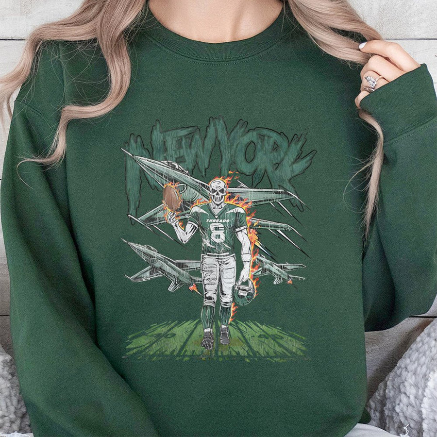 New York With A Skeleton Football Player Wearing Jersey Number 8, Holding A Football And Helmet, With Fighter Jets In The Background Sweatshirt