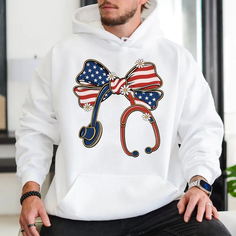 Patriotic Nurse Hoodie | Coquette USA Flag Stethoscope Bow Graphic | Soft Cotton Tee | 4th of July Gift for Medical Professional