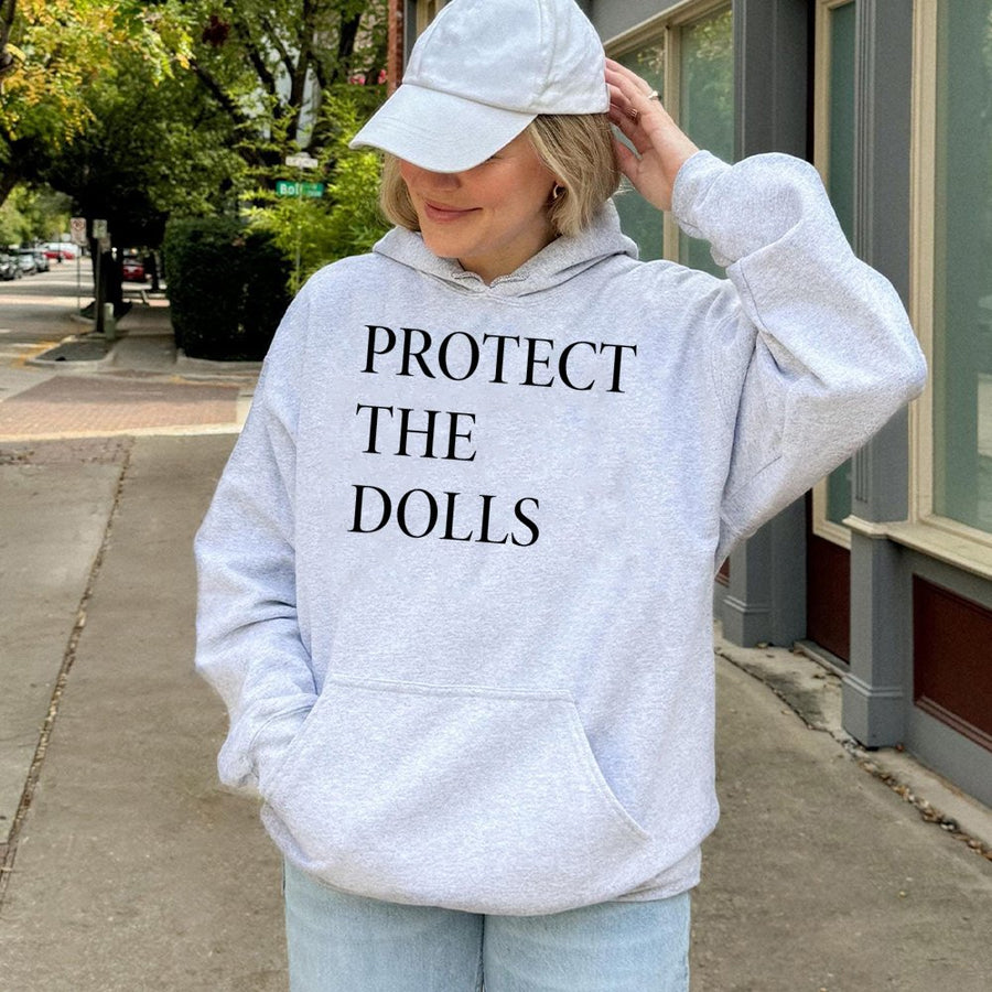 Protect The Dolls Hoodie | Gender Equality Social Justice Apparel | Soft Cotton-Blend Unisex Sweatshirt | Trans Rights Activist Gift
