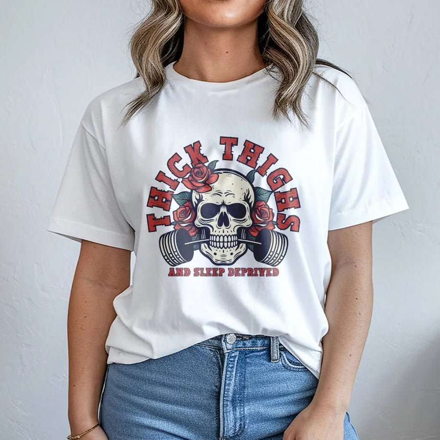 Thick Thighs And Sleep Deprived Graphic Tee | Skull Weightlifting Roses Design | 100% Cotton Premium Shirt | Funny Gym Workout Gift For Fitness Lovers