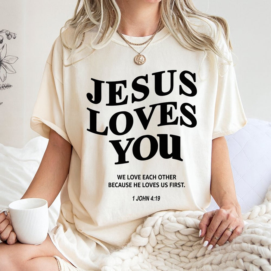 Jesus Loves You T-Shirt | 1 John 4:19 Bible Verse Graphic | Premium Cotton Unisex Tee | Religious Christian Gift for Men and Women