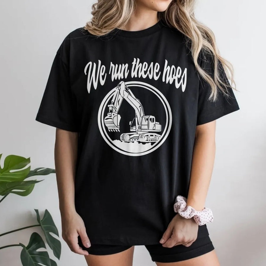 We Run These Hoes Excavator T-Shirt | Funny Construction Equipment Graphic | 100% Cotton Premium Tee | Heavy Equipment Operator Gift