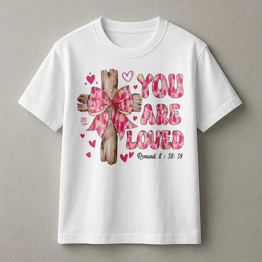 You Are Loved Christian T-Shirt | Pink Coquette Bow and Cross Design | Premium Soft Cotton Graphic Tee | Religious Valentines Day Gift for Women