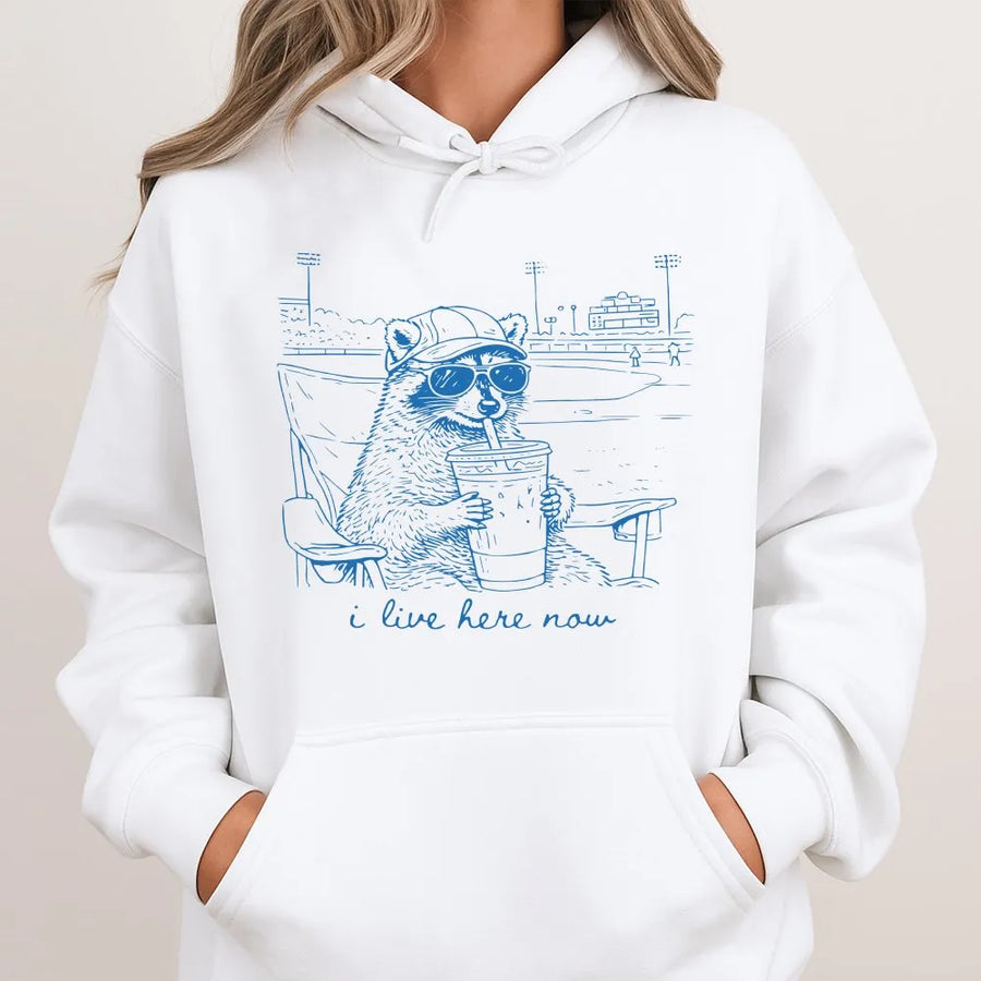 Funny Raccoon Baseball Hoodie | 'I Live Here Now' Graphic Sweatshirt | Premium Soft Blend | Humorous Gift for Sports Moms and Parents