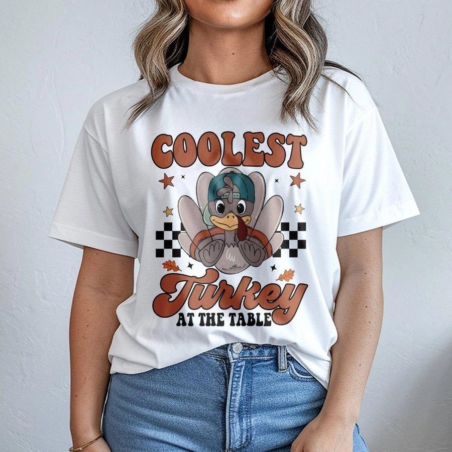 Coolest Turkey At The Table T-Shirt | Funny Retro Thanksgiving Graphic | Premium 100% Cotton Tee | Holiday Apparel Gift For Boys And Girls