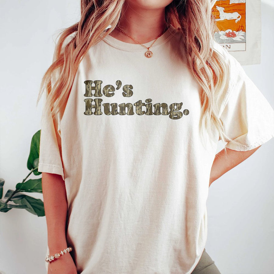 He's Hunting T-Shirt | Retro Camo Lettering Graphic Tee | Premium 100% Cotton | Funny Gift for Hunter's Wife or Girlfriend