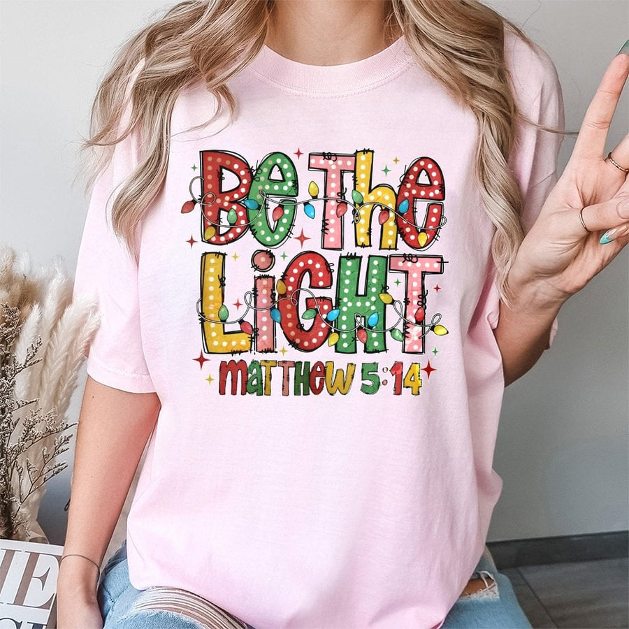 Be The Light Matthew 5:14 T-Shirt | Christmas Lights Graphic Design | 100% Premium Cotton | Faith-Based Christian Holiday Gift For Women