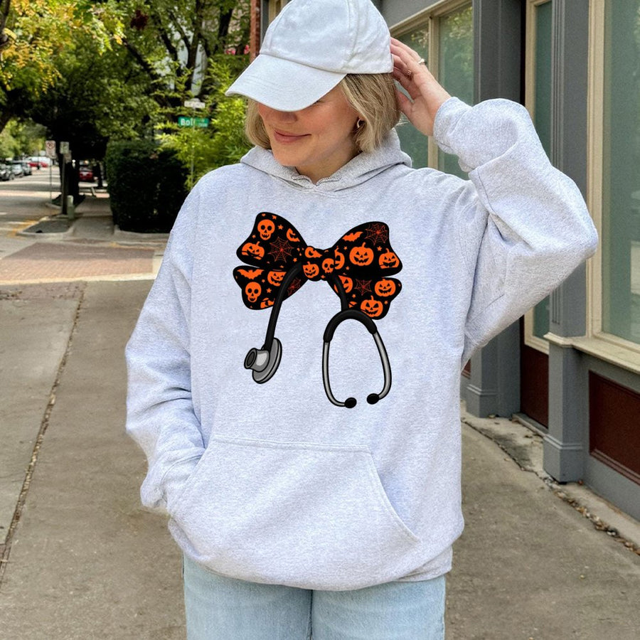 Nurse Halloween Hoodie | Stethoscope With Spooky Coquette Bow Graphic | Premium Cotton Blend | Gift For Nurses, CNA, Nursing Students