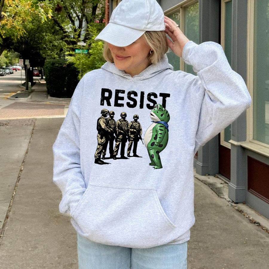 Resist Frog Hoodie | Activism Protest Graphic | Premium Cotton-Blend Apparel | Unisex Cozy Gift for Social Justice Advocates