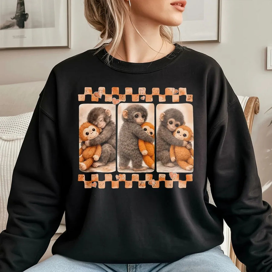 Cute Monkey Hugging Plush Toy Sweatshirt | Emotional Viral Animal Graphic | Premium Cotton Blend Crewneck | Gift For Monkey Lovers And Teens