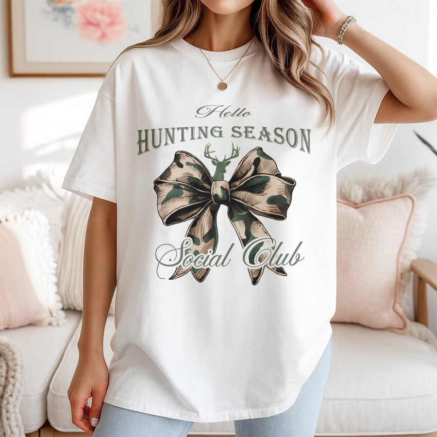 Hello Hunting Season T-Shirt | Camo Coquette Bow Graphic | 100% Cotton Premium Tee | Trendy Outdoors Aesthetic Gift for Women
