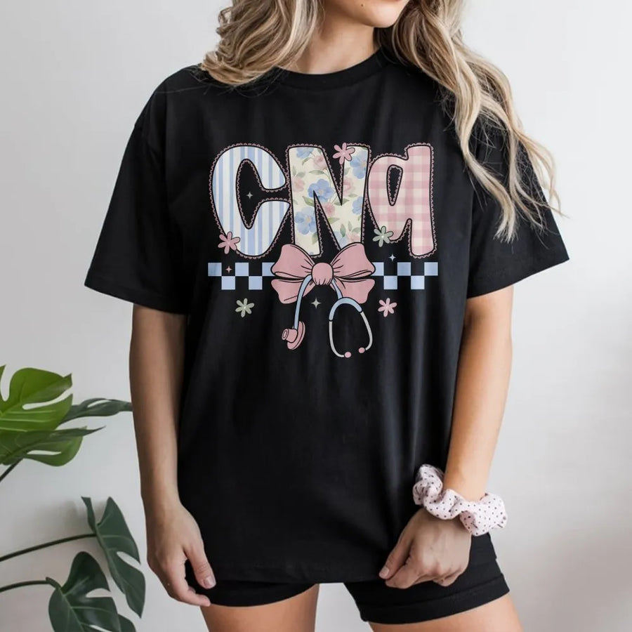 CNA Nurse T-Shirt | Coquette Floral Stethoscope Bow Graphic | Soft Cotton Blend | Nurses Week Appreciation Gift for Certified Nursing Assistant