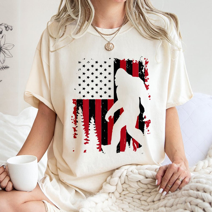 Bigfoot American Flag T-Shirt | Patriotic Sasquatch Forest Graphic | 100% Cotton Premium Tee | Unique Gift for Outdoor Lovers and Cryptozoology Fans