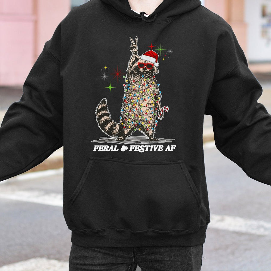 Feral & Festive Raccoon Hoodie | Funny Tangled Christmas Lights Graphic | Premium Cotton Blend Sweatshirt | Unique Holiday Gift for Raccoon Lovers