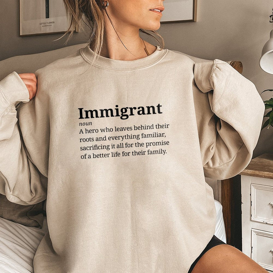 Immigrant Definition Sweatshirt | Hero Meaning Typography Graphic | Soft Cotton Blend Unisex Pullover | Meaningful Gift For New Citizens & Advocates