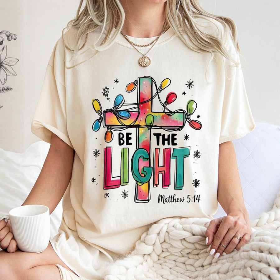 Be The Light Christian T-Shirt | Matthew 5:14 Bible Verse Christmas Graphic | Premium 100% Cotton | Religious Gift for Men and Women