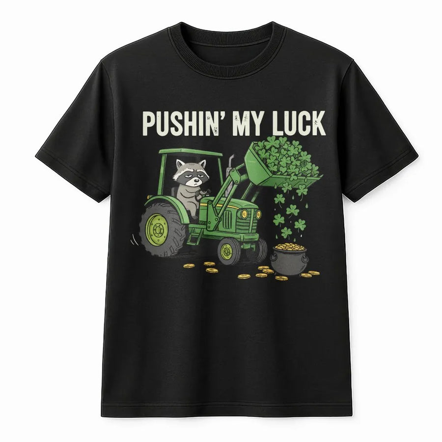 St Patrick’s Day Raccoon T-Shirt | Funny Tractor Clover Graphic | Premium 100% Cotton Tee | Gift for Farmers and Animal Lovers