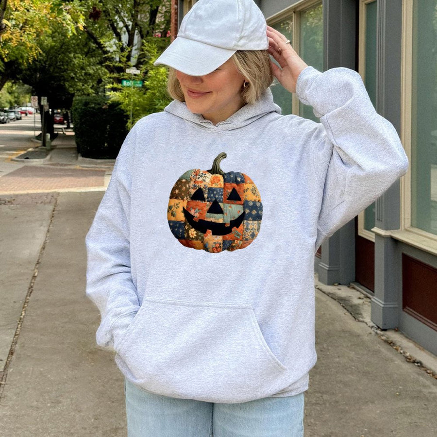 Patchwork Pumpkin Hoodie | Retro Quilt Style Jack O Lantern Graphic | Premium Cotton Blend | Cozy Fall Apparel for Halloween Lovers