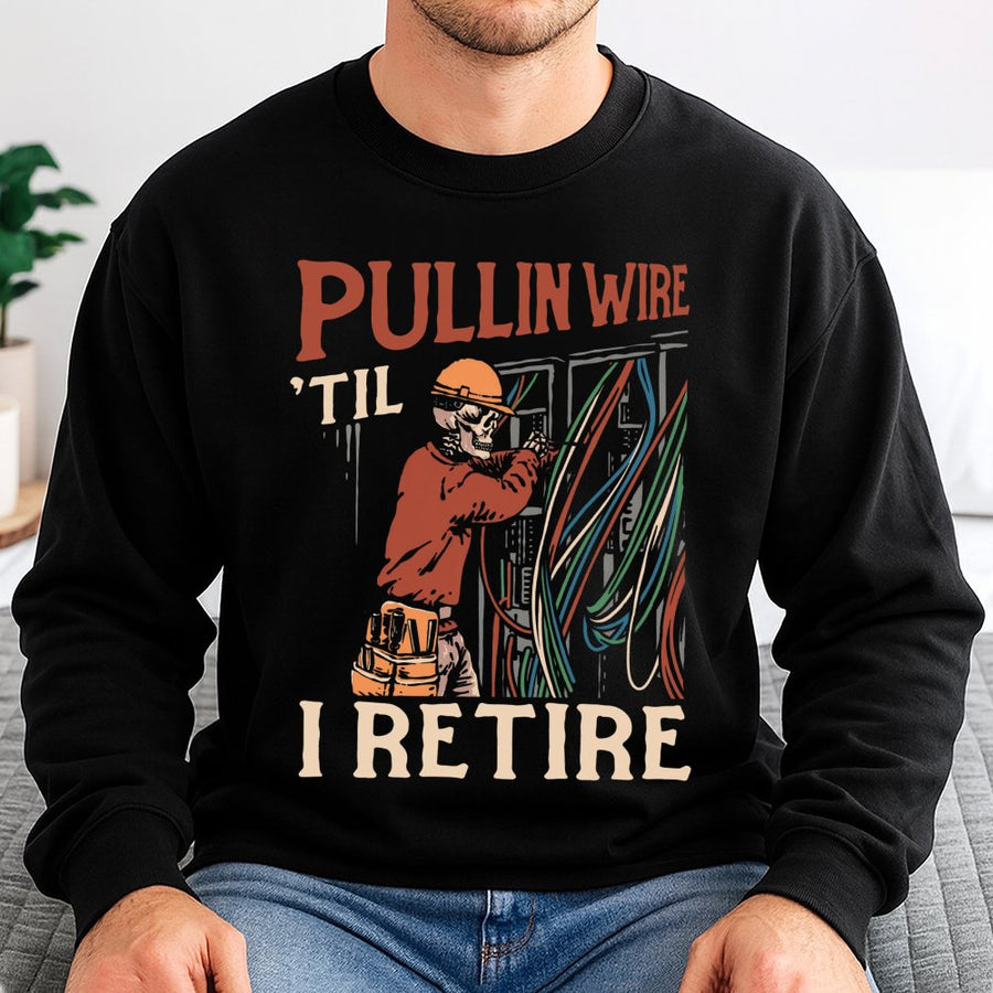 Electrician Sweatshirt | Pullin Wire 'Til I Retire Skeleton Graphic | Premium Cotton Blend Crewneck | Funny Blue Collar Gift For Journeyman Lineman