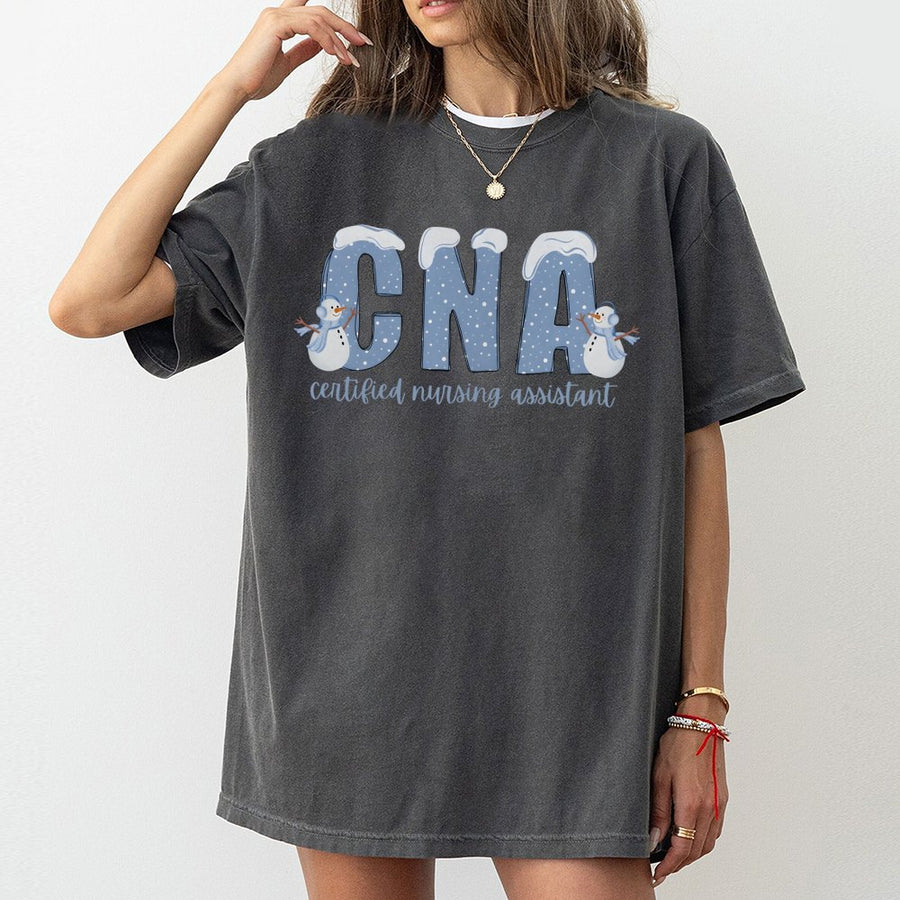 CNA T-Shirt | Winter Snowman Nursing Assistant Graphic | Premium Cotton Gift for Nurses | Holiday Medical Professional Work Shirt