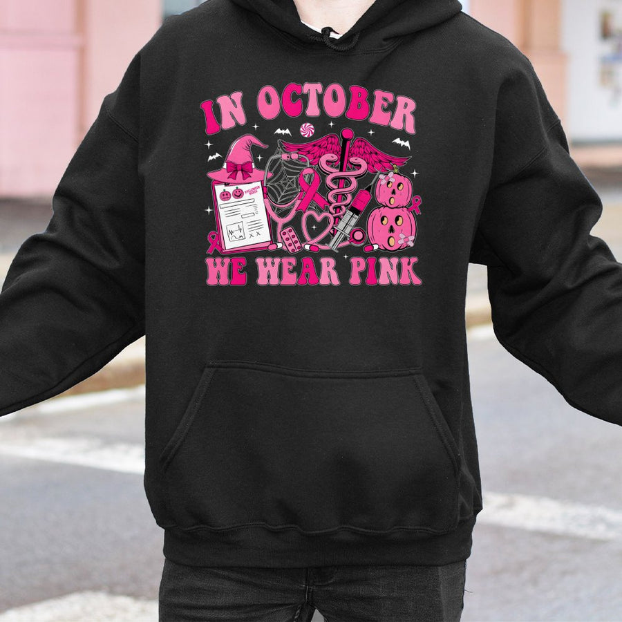 In October We Wear Pink Nurse Hoodie | Breast Cancer Awareness Halloween Graphic | Cotton-Blend Comfort | Gift for Nurses and Cancer Survivors