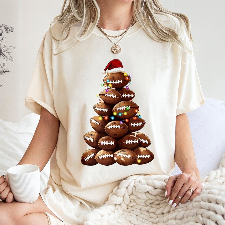 Football Christmas Tree T-Shirt | Sporty Holiday Graphic with Santa Hat & Lights | 100% Cotton Premium Tee | Unique Gift for Football Fans & Coaches