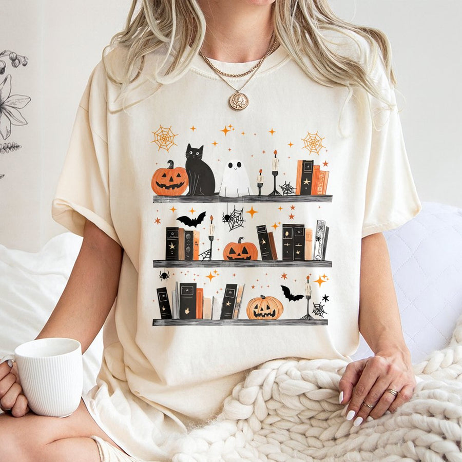Halloween Bookshelf T-Shirt | Spooky Ghost Cat Reading Graphic | Premium 100% Cotton Tee | Cute Fall Book Lover Gift for Women & Readers